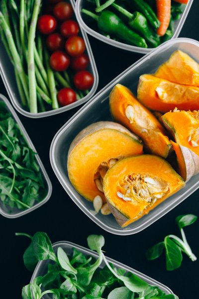 Round translucent food-grade plastic container with dough inside, similar to a Cambro